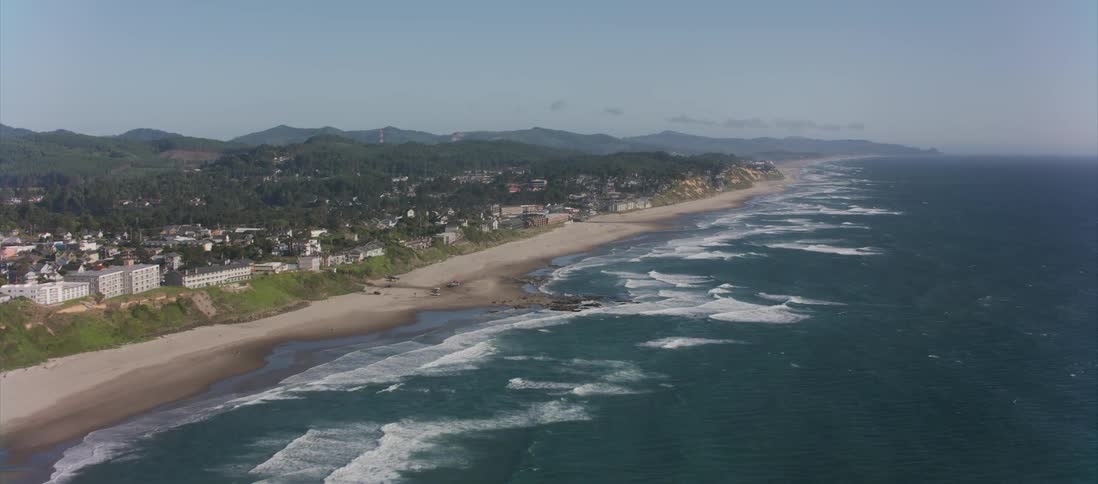 Camera flies along the city built on an ocean coast
