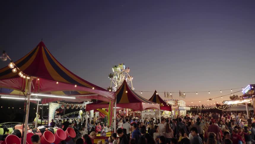 People are gathered at a carnival