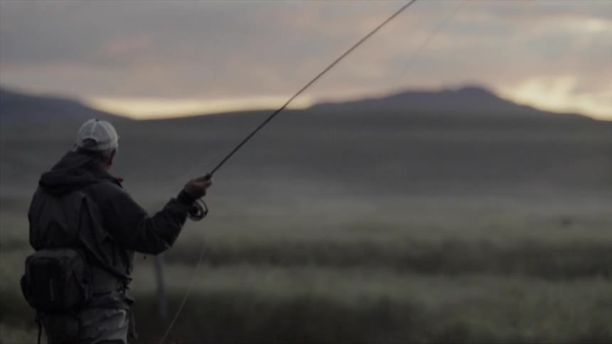 A man throws a fishing line out