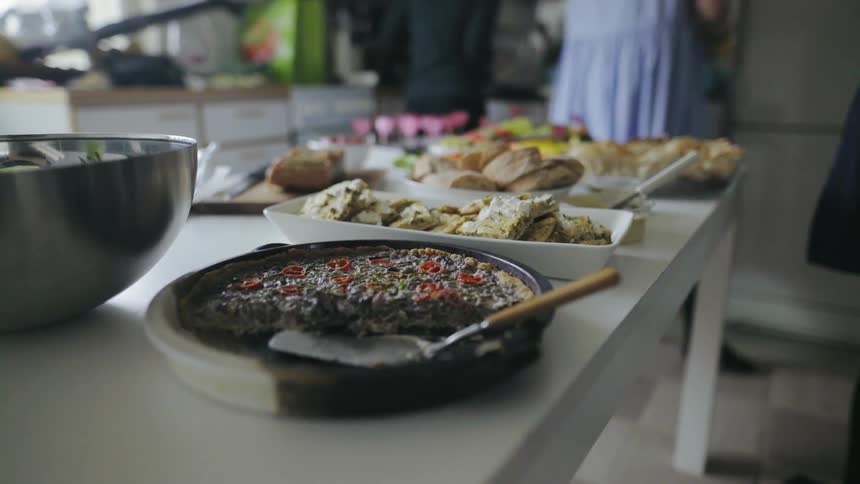 Various dishes laid out on the table at home