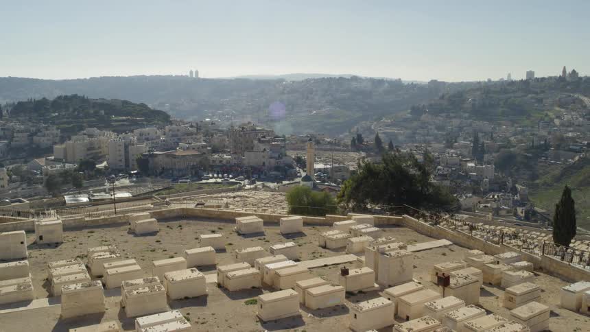 Aerial view of a white sarcophagi in the middle of city built on hills