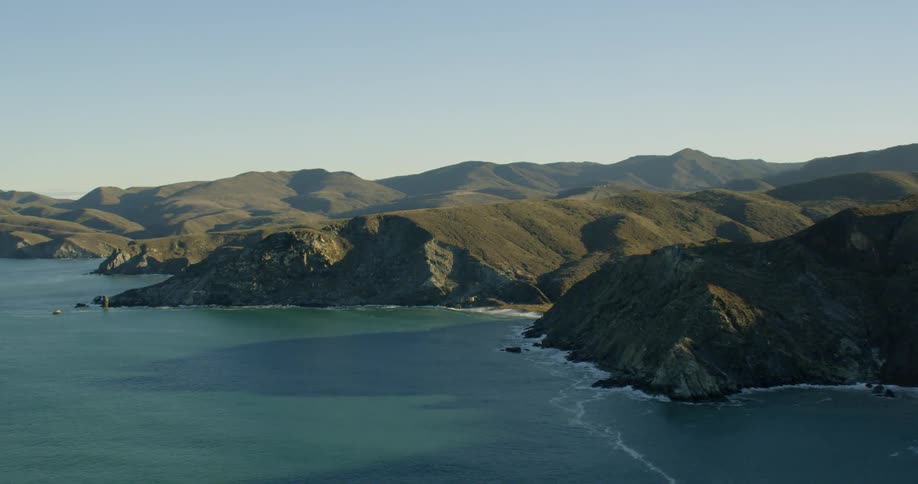 Many hills show near the water