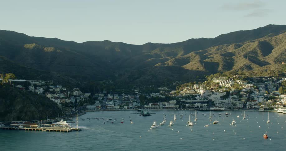 Avalon Harbor in coastal bay with boats during sunset, Catalina