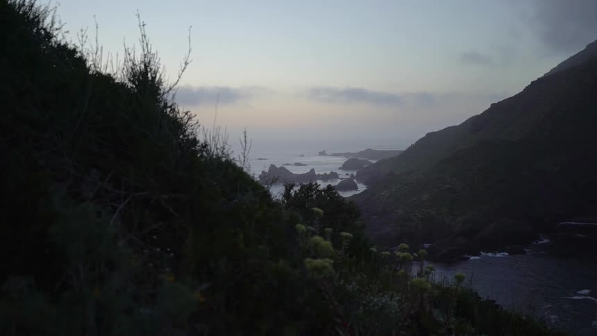 Looking at the ocean through two mountains