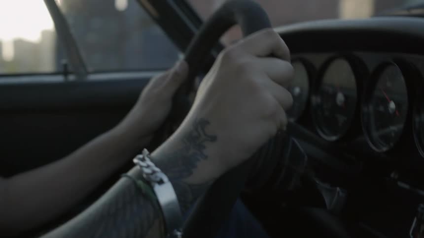 Human driving a car