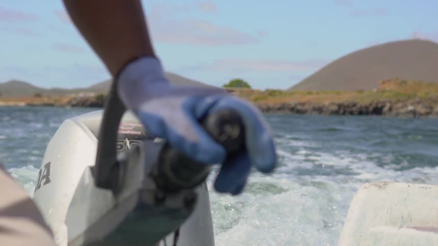 A person steering a boat