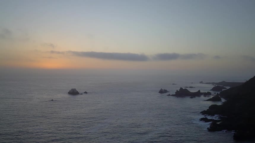 The sun sets over the ocean