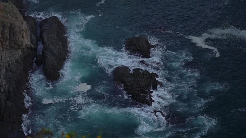 Ocean waves on a rocky cliff