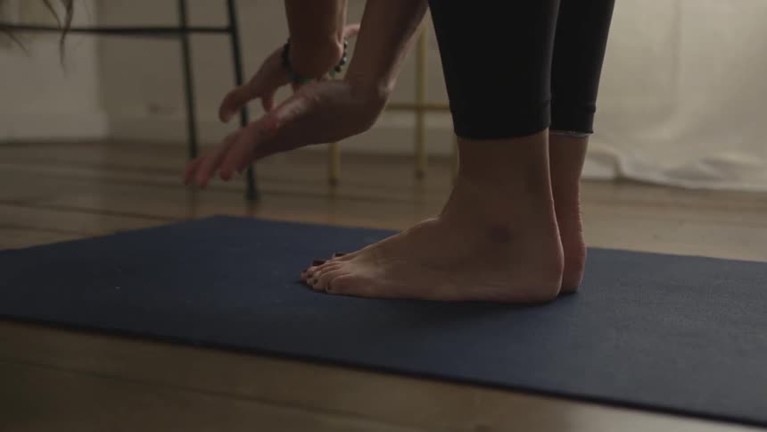 A young woman practices yoga