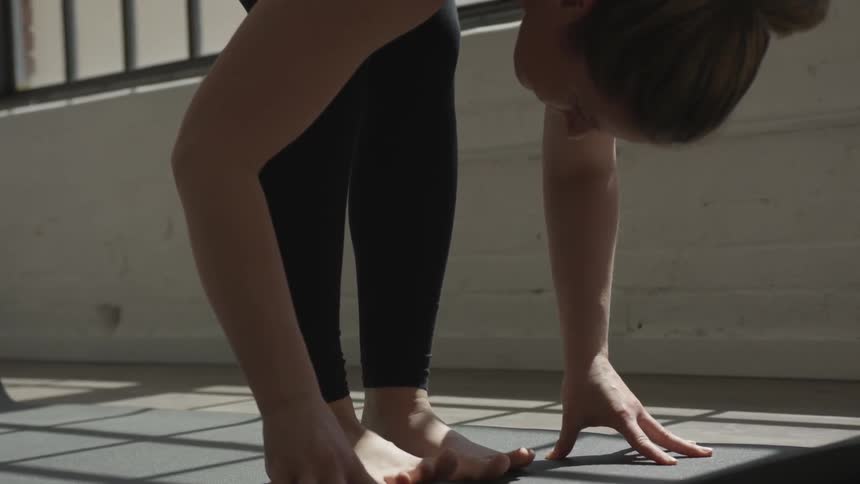 A woman does yoga indoors