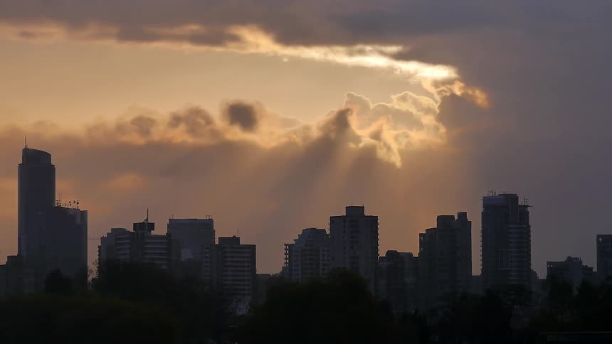 A city skyline at dawn