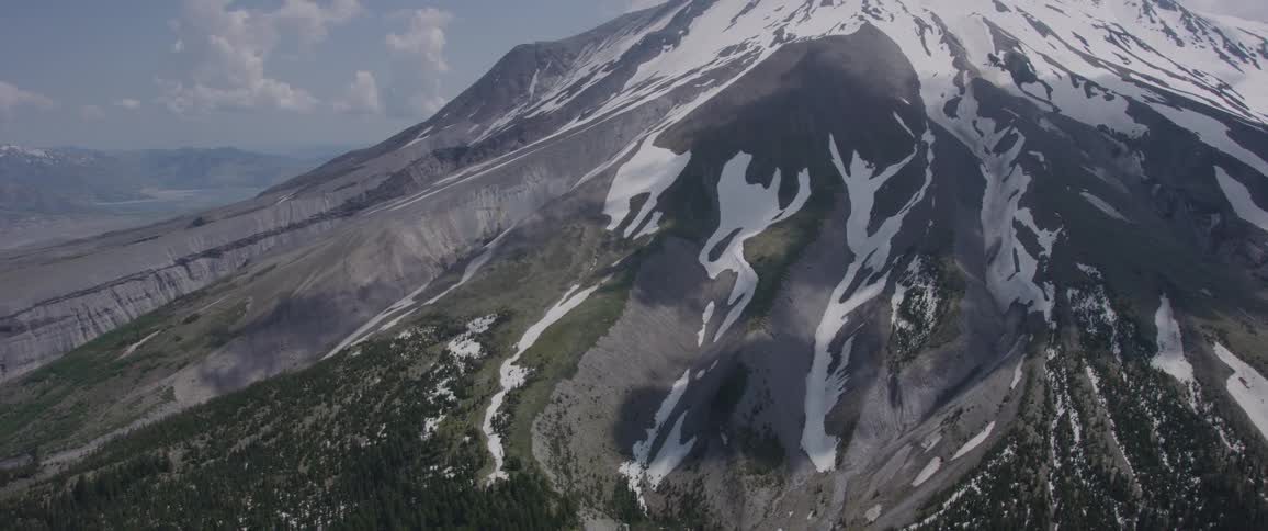 The camera flies next to a large mountain