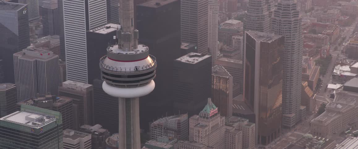 An aerial view of a downtown city is displayed