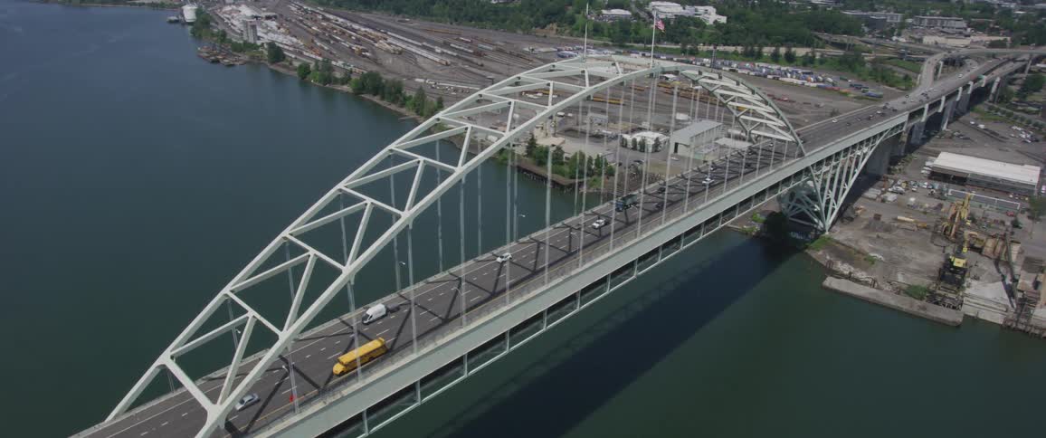 A city bridge crosses a river