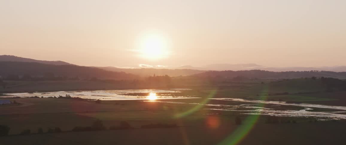 The sun is setting in the horizon