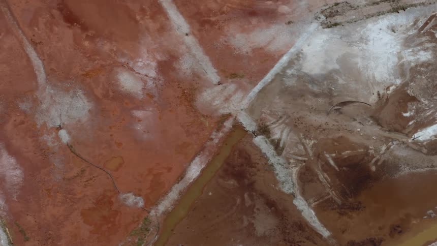 Shadows move across a scarred landscape