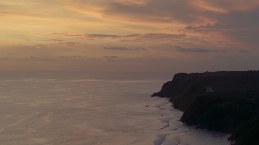 Waves rolling in to the mountainside