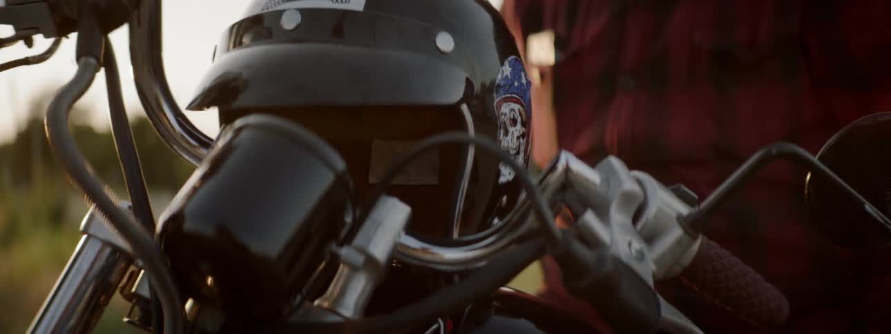 Man sits on motorcycle