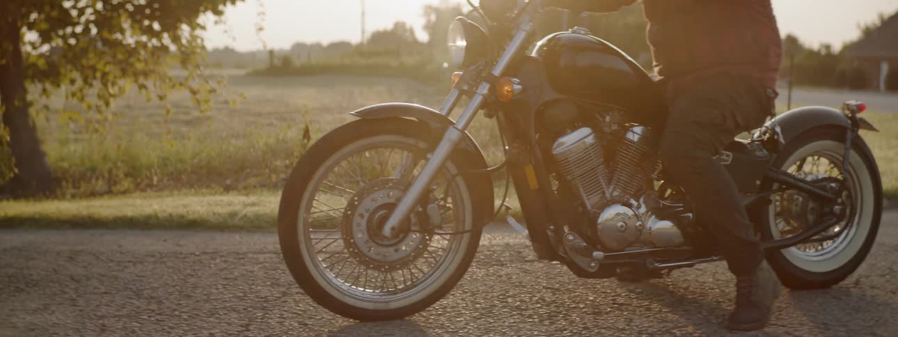 Two men pull off on their motorcycles