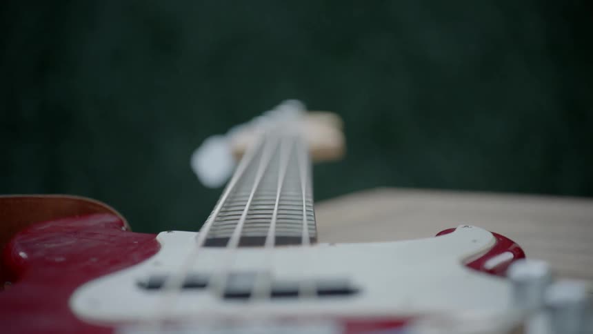 A guitar rests on a table