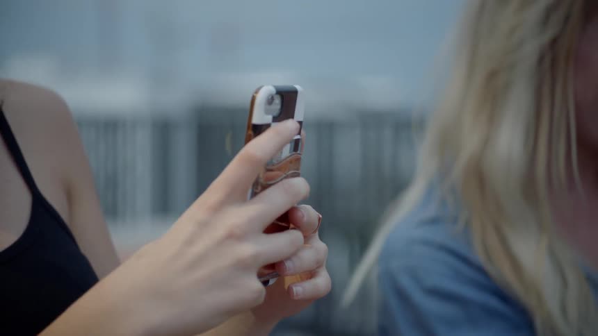 A woman is looking at her phone