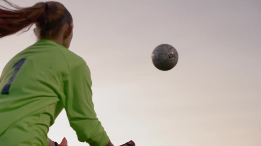 A girls tosses a ball to another girl