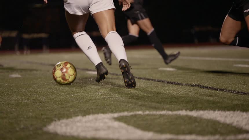 Two teams play soccer on a soccer field
