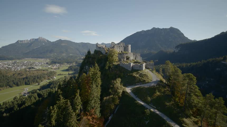 A castle sits atop a mountain