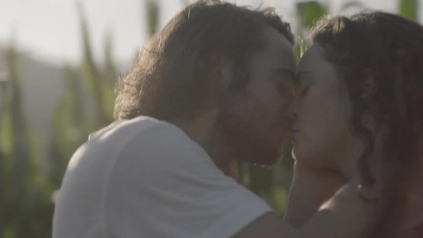 Two people kissing each other