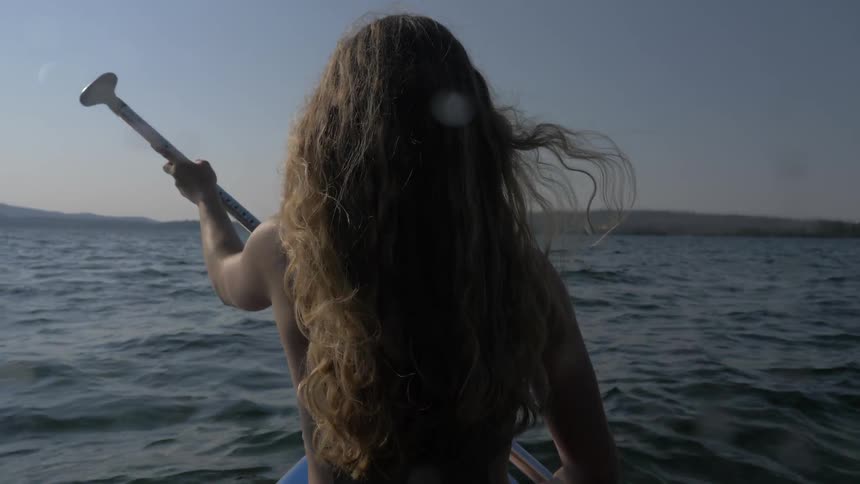 Girl paddling a boat