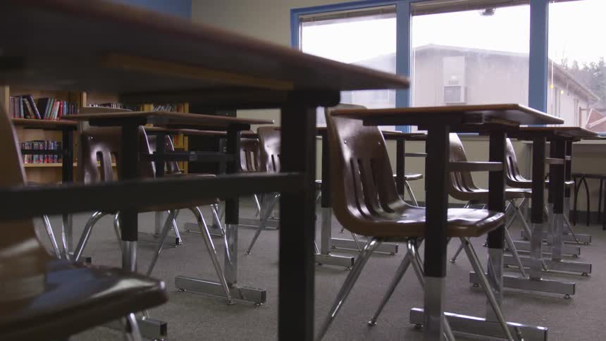 The camera looks at a classroom