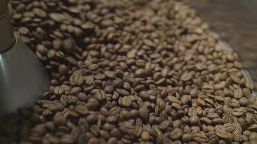 Coffee beans are churned