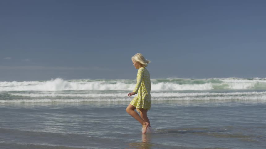 Girl walking on beach