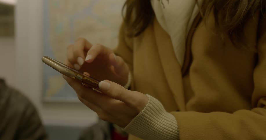 A woman is using her cell phone