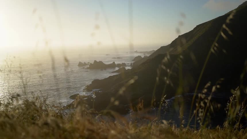 A rocky ocean coastline during the day
