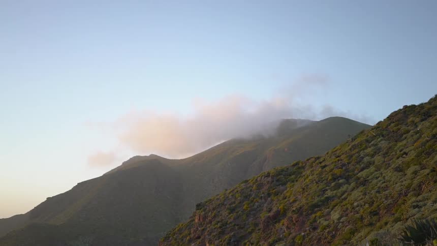 Landscape of the mountain covered with cloud at sunset