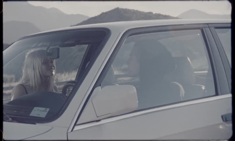 A couple arguing inside a car