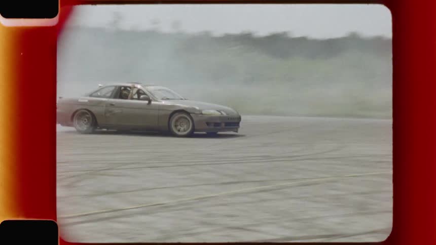 A vintage shot of a car drifting