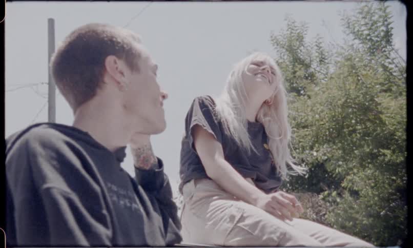 Friends hanging out outside on a sunny day