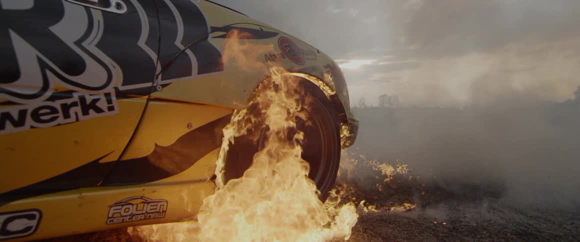 A car is parked on the track on fire