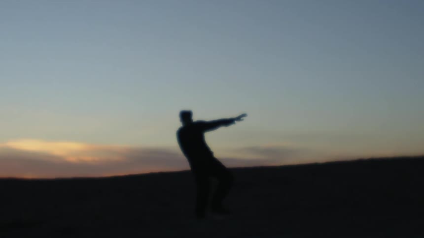 Man dancing at dusk