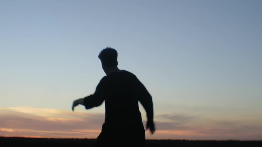 A person dances outside