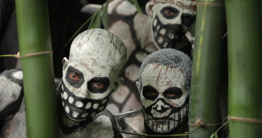 People painted as skeletons