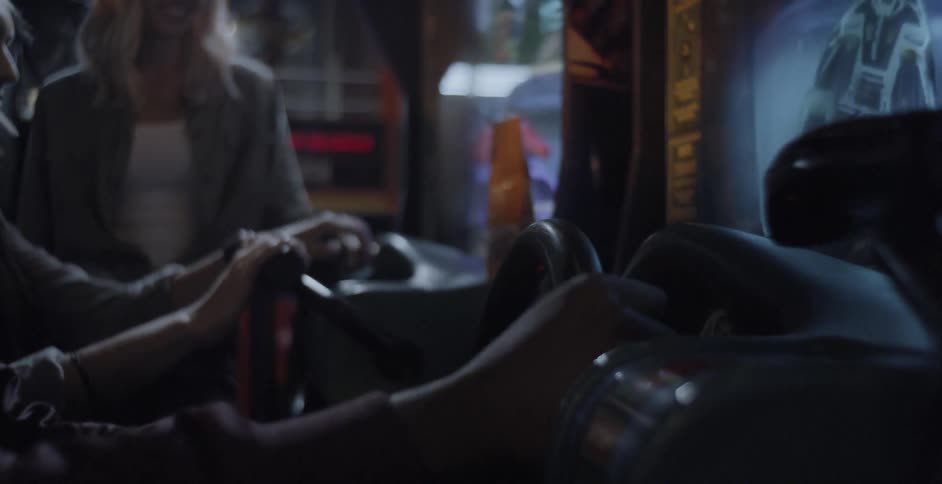 A group of people playing games at an arcade