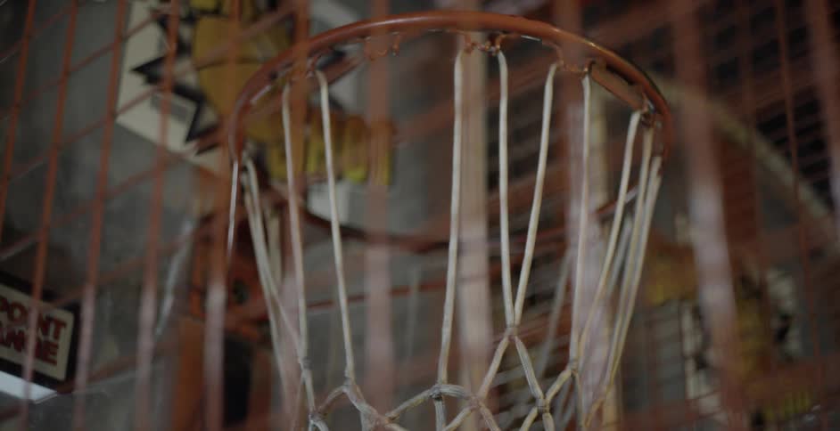 Basketball enters hoop in arcade