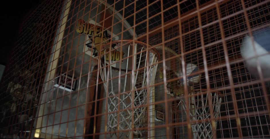 Basketballs being thrown in to hoops