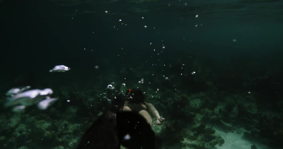 A woman snorkeling under water