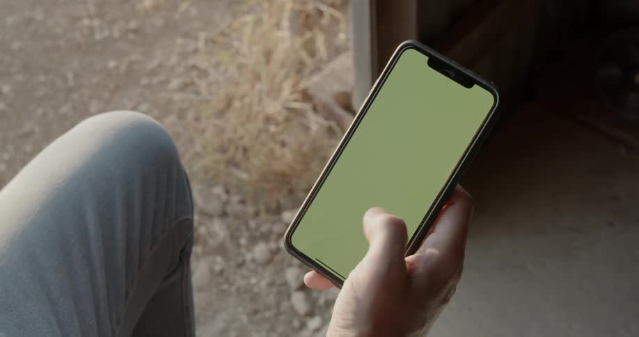 Man scrolls through cell phone