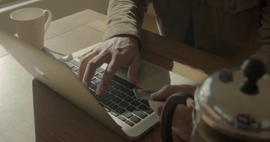 A person typing in their credit card info