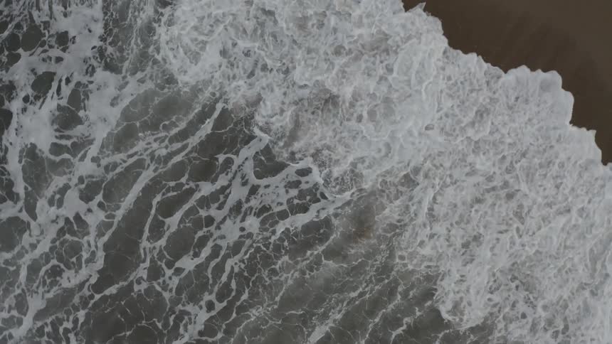 Waves crashing onto the beach